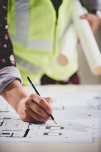 architect concept, working architect with blueprints in office to present to customers